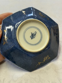 A pair of Chinese gilt-decorated powder-blue-ground 'Antiquities' cups and saucers, lingzhi mark, Kangxi