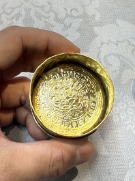 A fine Tibetan gilt-bronze box and cover with repouss&eacute; scroll decoration, 18th C.