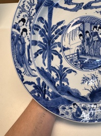 A fine Chinese blue and white 'Elegant Beauties' dish with raised central medallion, Kangxi