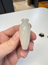 A Chinese carved white jade 'Geese' snuff bottle with a wooden stand, 18/19th C.
