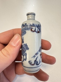 Two Chinese blue, white and copper-red snuff bottles with narrative design, 19th C.