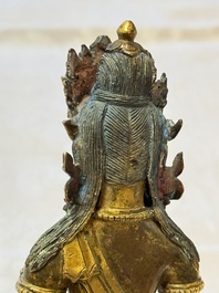 A Sino-Tibetan gilt-bronze figure of Buddha Amitayus, inscribed, Qianlong