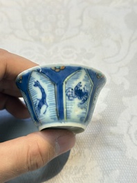 A Chinese European-decorated blue and white 'Fisherman' cup and saucer, Kangxi
