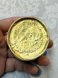 A fine Tibetan gilt-bronze box and cover with repouss&eacute; scroll decoration, 18th C.