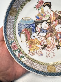A fine Chinese famille rose eggshell plate with a lady and playing boys, Yongzheng