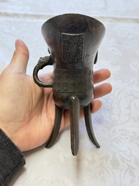 A Chinese archaistic bronze ritual wine vessel, Jue 爵, Qianlong mark, dated 1738