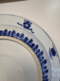 A fine Chinese blue and white 'Elegant Beauties' dish with raised central medallion, Kangxi