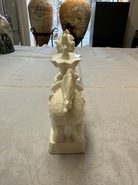 A Chinese Dehua blanc de Chine candlestick in the form a qilin, Kangxi