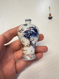 A Chinese blue, white and copper-red 'Dragon' snuff bottle, 19th C.