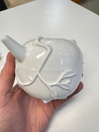 A Chinese Dehua blanc de Chine 'Pomegranate' teapot and cover, Kangxi