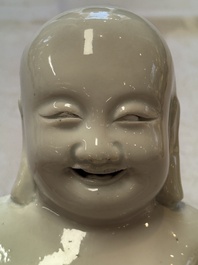 A Chinese white-glazed Milefo Buddha, 19th C.