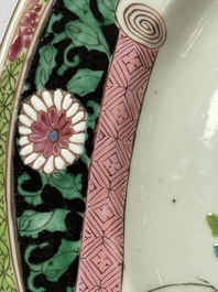 A pair of fine Chinese famille rose black-ground 'Scrolls and Flowers' plates, Yongzheng/Qianlong