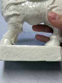 A Chinese Dehua blanc de Chine candlestick in the form a qilin, Kangxi