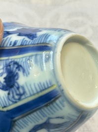 A Chinese European-decorated blue and white 'Fisherman' cup and saucer, Kangxi