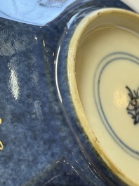 A pair of Chinese gilt-decorated powder-blue-ground 'Antiquities' cups and saucers, lingzhi mark, Kangxi