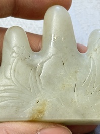 A Chinese white jade mountain-shaped brush rest with narcissus design, Dajie 大玠 mark, dated 1879