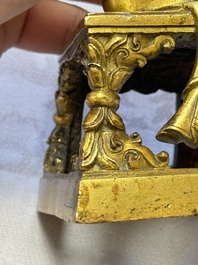 A Sino-Tibetan gilt-bronze figure of Buddha Amitayus, inscribed, Qianlong