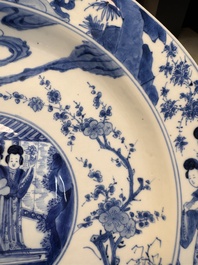 A fine Chinese blue and white 'Elegant Beauties' dish with raised central medallion, Kangxi