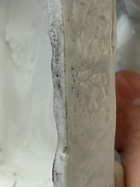A Chinese Dehua blanc de Chine candlestick in the form a qilin, Kangxi