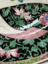 A pair of fine Chinese famille rose black-ground 'Scrolls and Flowers' plates, Yongzheng/Qianlong