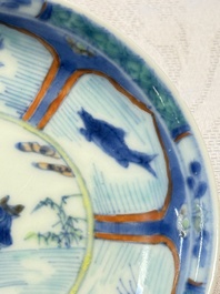 A Chinese European-decorated blue and white 'Fisherman' cup and saucer, Kangxi