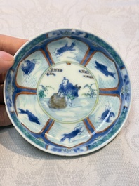 A Chinese European-decorated blue and white 'Fisherman' cup and saucer, Kangxi