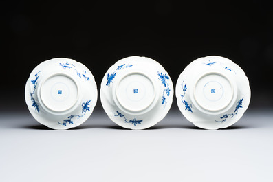 Eleven Chinese blue and white gadrooned 'Flowers and Peacocks' plates, Kangxi
