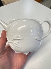A Chinese Dehua blanc de Chine 'Pomegranate' teapot and cover, Kangxi