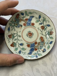 Two Dutch-decorated Chinese cups and saucers with parrots among flowering branches, 18th C.
