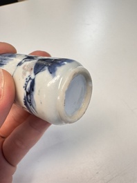 Two Chinese blue, white and copper-red snuff bottles with figural design, 19th C.