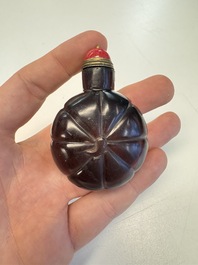 Two Chinese glass snuff bottles and a buffalo bone snuff bottle, Xianfeng mark, 19th C.