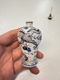 A Chinese blue, white and copper-red 'Dragon' snuff bottle, 19th C.