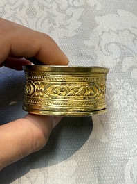 A fine Tibetan gilt-bronze box and cover with repouss&eacute; scroll decoration, 18th C.