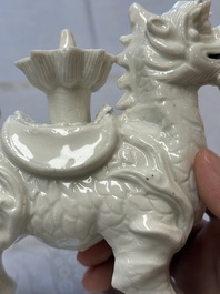 A Chinese Dehua blanc de Chine candlestick in the form a qilin, Kangxi