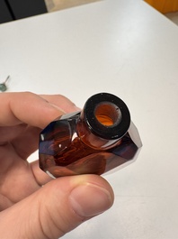 A Chinese facetted amber glass snuff bottle, 19th C.