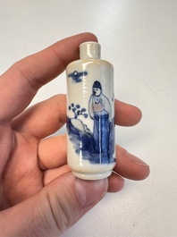 Two Chinese blue, white and copper-red snuff bottles with figural design, 19th C.