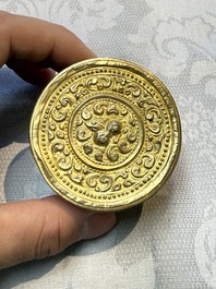 A fine Tibetan gilt-bronze box and cover with repouss&eacute; scroll decoration, 18th C.