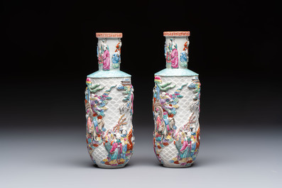 A pair of Chinese famille rose relief-moulded 'Immortals' vases, Qianlong mark, Republic