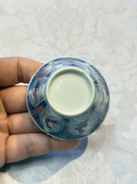 A Chinese European-decorated blue and white 'Fisherman' cup and saucer, Kangxi