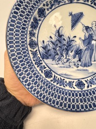 A Chinese blue and white 'La Dame au Parasol' plate after Cornelis Pronk, Qianlong