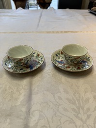 Two Dutch-decorated Chinese cups and saucers with parrots among flowering branches, 18th C.