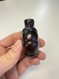 Two Chinese glass snuff bottles and a buffalo bone snuff bottle, Xianfeng mark, 19th C.