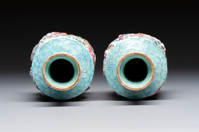 A pair of Chinese famille rose relief-moulded 'Immortals' vases, Qianlong mark, Republic