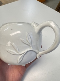 A Chinese Dehua blanc de Chine 'Pomegranate' teapot and cover, Kangxi