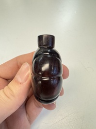 Two Chinese glass snuff bottles and a buffalo bone snuff bottle, Xianfeng mark, 19th C.