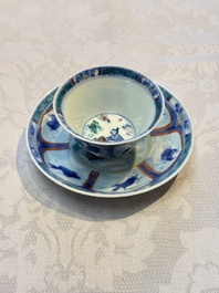 A Chinese European-decorated blue and white 'Fisherman' cup and saucer, Kangxi