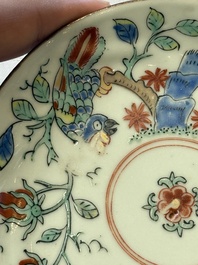 Two Dutch-decorated Chinese cups and saucers with parrots among flowering branches, 18th C.