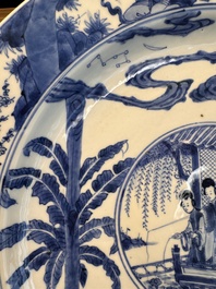 A fine Chinese blue and white 'Elegant Beauties' dish with raised central medallion, Kangxi