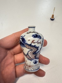 A Chinese blue, white and copper-red 'Dragon' snuff bottle, 19th C.