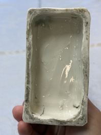 A Chinese Dehua blanc de Chine candlestick in the form a qilin, Kangxi